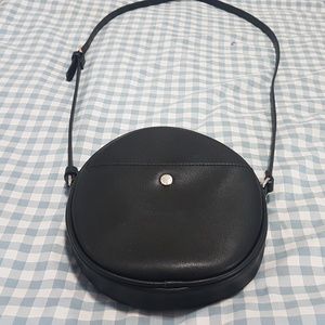 The Lovely Tote Co. Round Circle Black Crossbody Bag